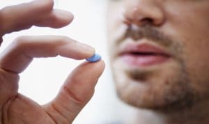 Man takes Viagra pill